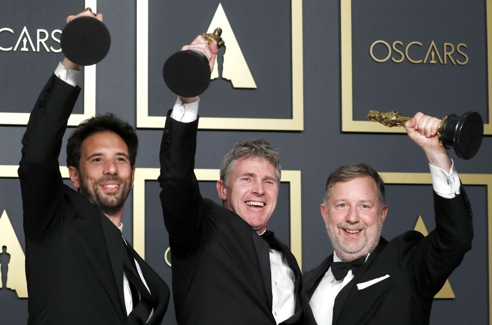 Guillaume Rocheron, Greg Butler and Dominic Tuohy pose with the Oscar for Best Visual Effects for "1917" in the photo room during the 92nd Academy Awards in Hollywood, Los Angeles, California, U.S., February 9, 2020. REUTERS/Lucas Jackson