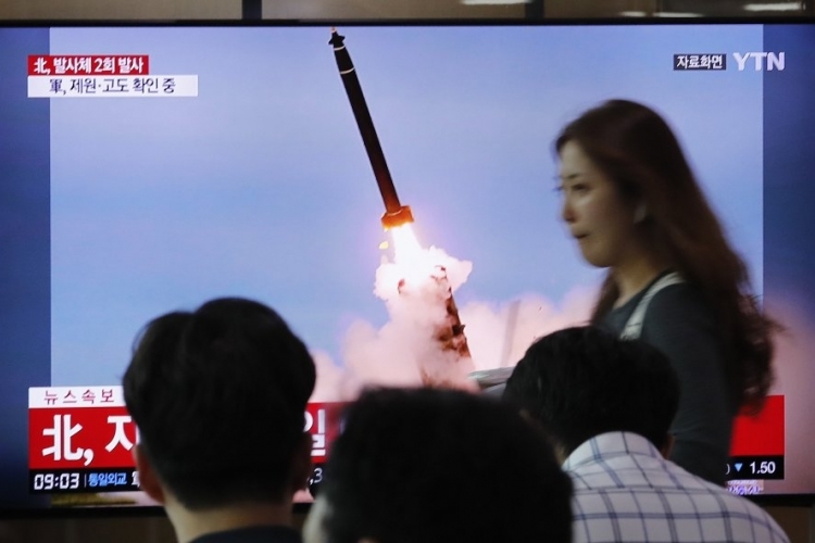 North Korea fires 2 projectiles after offering talks with US