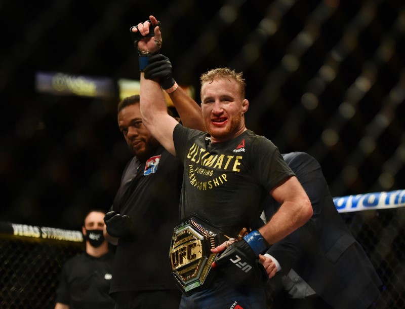 May 9, 2020; Jacksonville, Florida, USA; Dana White puts the championship belt on Justin Gaethje (blue gloves) after defeating Tony Ferguson (red gloves) during UFC 249 at VyStar Veterans Memorial Arena. Mandatory Credit: Jasen Vinlove-USA TODAY Sports