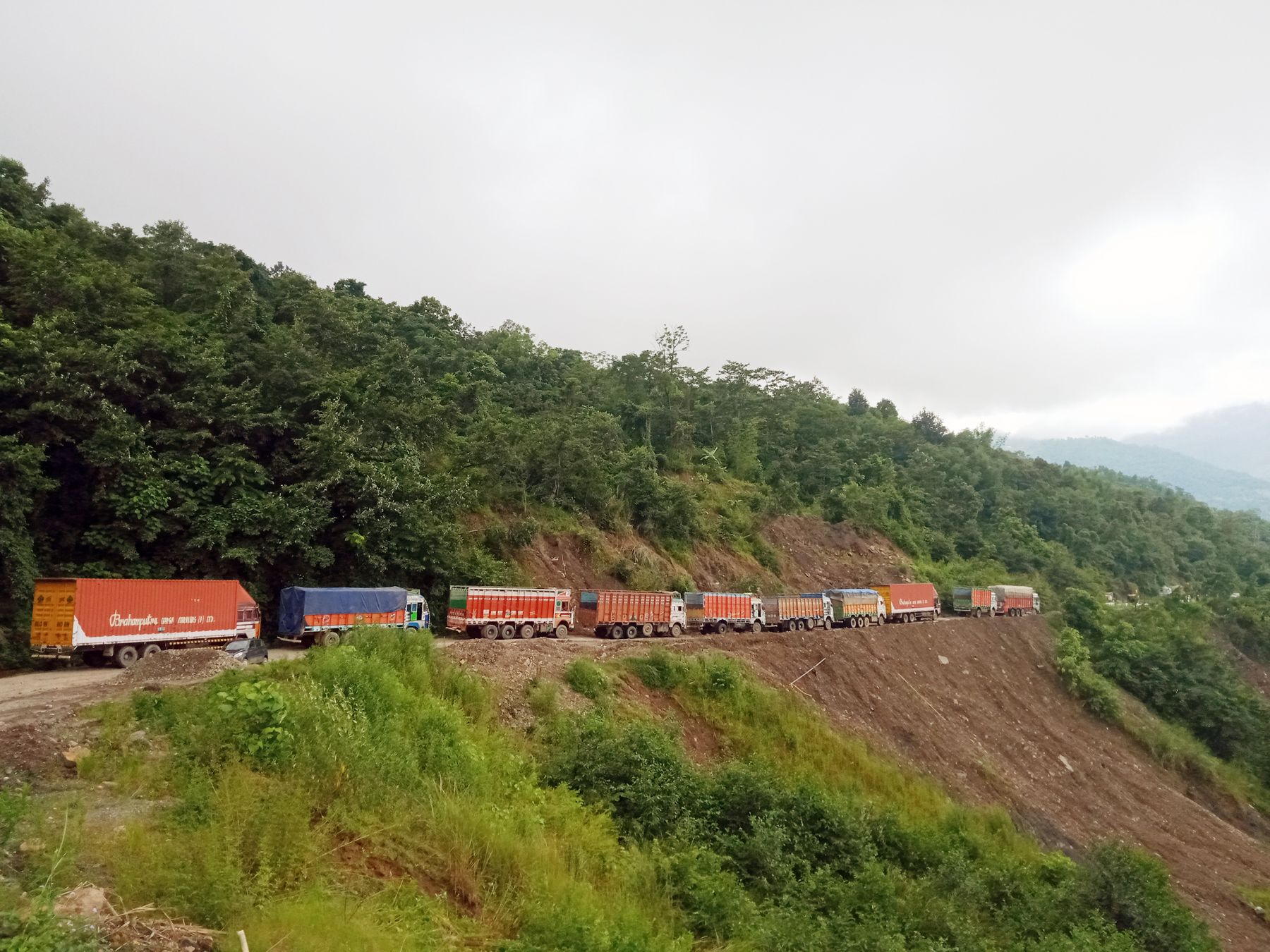 (Right) Manipur bound trucks stranded on the National Highway 29 on August 4. (Morung Photos)