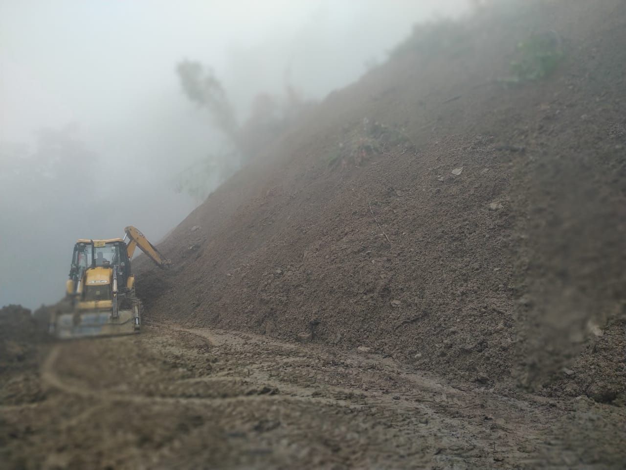 An excavator at work on April 24 near the Impur junction, NH2. Mudslides have occurred intermittently since April 23. (Photo Courtesy: EE, PWD (NH), Mokokchung Division)