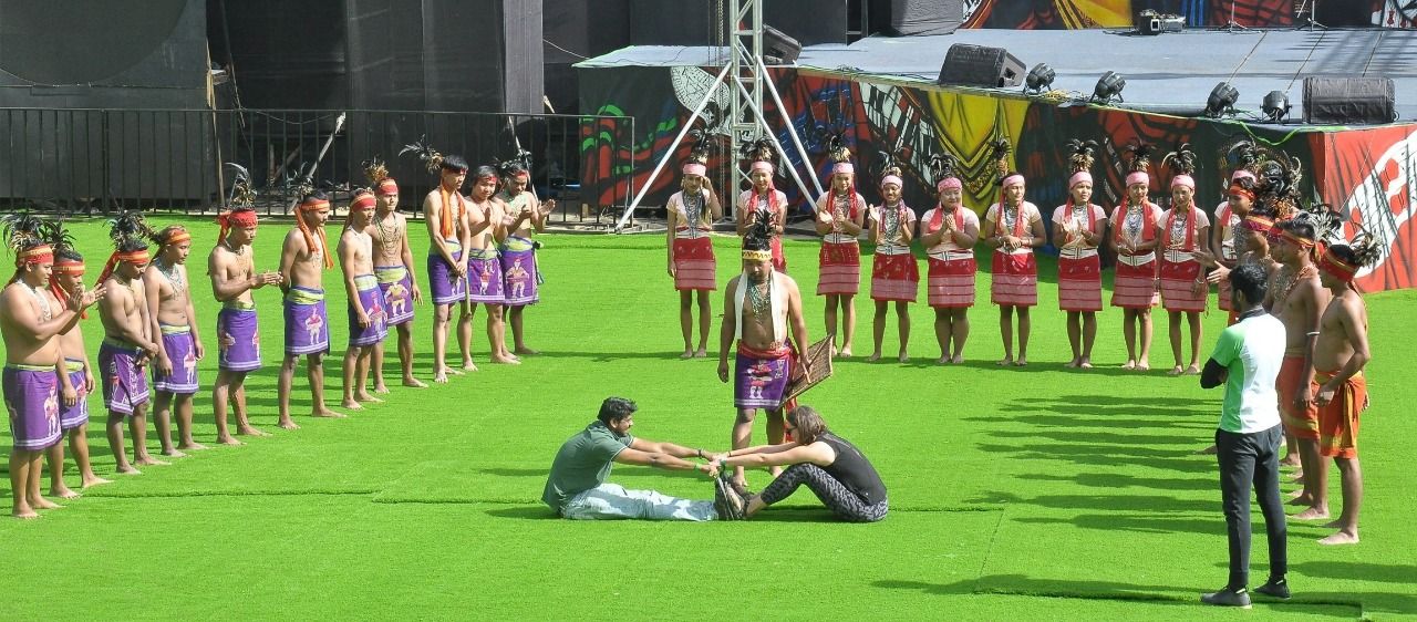 Tourist try playing the traditional game called 'Ading Sala' performed by the Garo cultural troupe on the 2nd day of the Hornbill festival held at Naga Heritage Village, Kisama on December 2. (DIPR Photo)