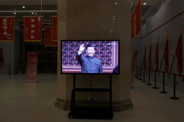 A screen shows a video footage of Chinese President Xi Jinping gesturing during the military parade marking the 70th founding anniversary of People's Republic of China on October 1, 2019, at the Military Museum of the Chinese People's Revolution in Beijing, China on May 26. (REUTERS Photo)