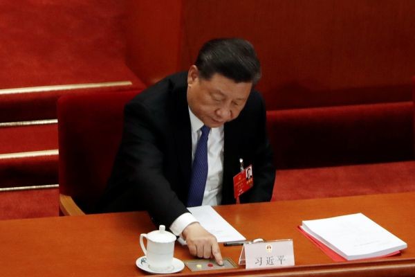 Chinese President Xi Jinping casts his vote on the national security legislation for Hong Kong Special Administrative Region at the closing session of the National People's Congress (NPC) at the Great Hall of the People in Beijing, China ON May 28. (REUTERS  Photo)