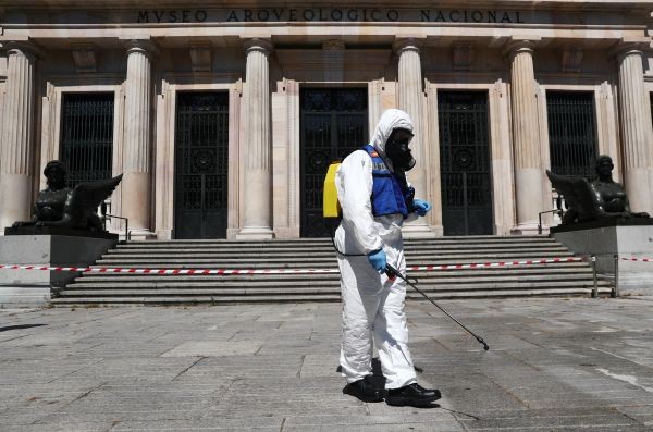 A member of the Spanish Emergency Military Unit (UME) wearing a full personal protective equipment disinfects outside the Archaeological Museum amid the coronavirus disease (COVID-19) outbreak, in Madrid, Spain on May 25, 2020. (REUTERS Photo)