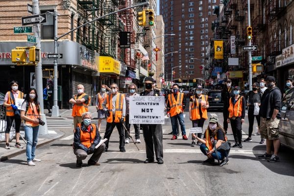 Volunteers from the Chinatown Block Watch neighborhood patrol group pose for pictures before patrolling in Chinatown during the outbreak of the coronavirus disease (COVID-19) in New York City, New York, US on May 17, 2020. (REUTERS File Photo)