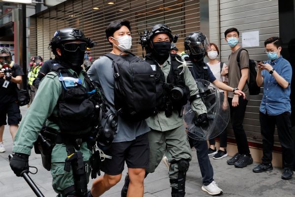 Riot police officers detain a demonstrator during a protest against the second reading of a controversial national anthem law in Hong Kong, China on May 27. (REUTERS Photo)