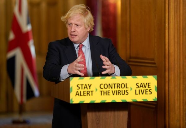Britain's Prime Minister Boris Johnson holds a daily news conference with Public Health England's (PHE) Medical Director Yvonne Doyle (not pictured), on the coronavirus disease (COVID-19) outbreak, at 10 Downing Street in London, Britain on May 25, 2020. (REUTERS Photo)