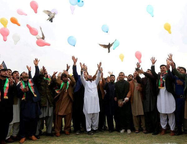 Afghan men celebrate in anticipation of the U.S-Taliban agreement to allow a U.S. troop reduction and a permanent ceasefire, in Jalalabad, Afghanistan on February 28, 2020. (REUTERS File Photo)