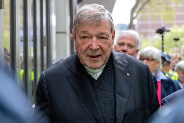 Vatican Treasurer Cardinal George Pell is surrounded by Australian police as he leaves the Melbourne Magistrates Court in Australia on October 6, 2017.    (REUTERS File Photo)