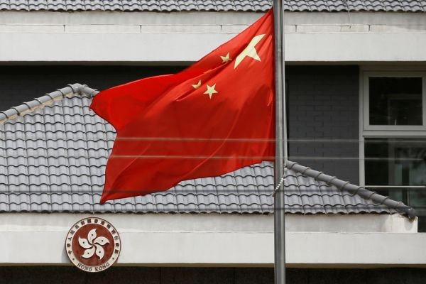 The Chinese flag flutters at the office of the Government of the Hong Kong Special Administrative Region in Beijing, China on May 25. (REUTERS Photo)