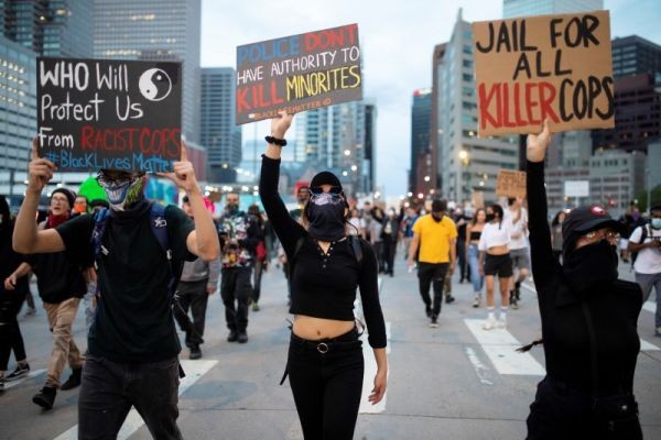 Protesters wearing protective face coverings peacefully march down Broadway from the State Capitol despite the 9 p.m. curfew in Denver, Colorado, US on June 1, 2020. (REUTERS Photo)