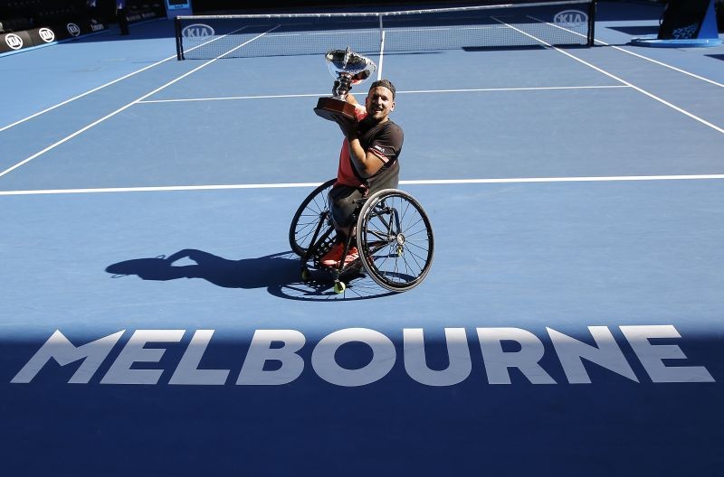 FILE PHOTO: Tennis - Australian Open - Quad wheelchair singles final - Rod Laver Arena, Melbourne, Australia, January 27, 2018. Winner Dylan Alcott of Australia poses with the trophy. REUTERS/Thomas Peter/File photo