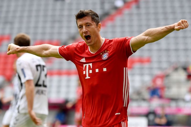 Soccer Football - Bundesliga - Bayern Munich v SC Freiburg - Allianz Arena, Munich, Germany - June 20, 2020 Bayern Munich's Robert Lewandowski celebrates scoring a goal, following the resumption of play behind closed doors after the outbreak of the coronavirus disease (COVID-19) Sven Hoppe/Pool via REUTERS
