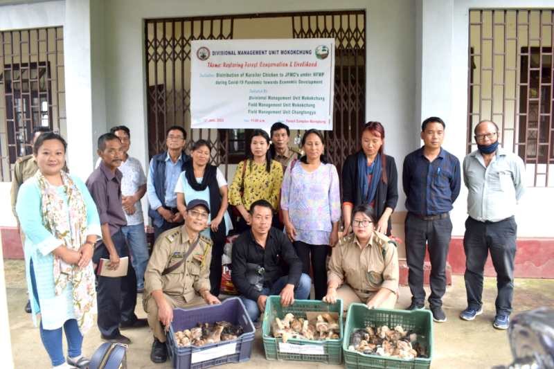 Officials with others during the “distribution of Kuroiler chicks to JFMCs under NFMP during COVID-19 pandemic towards economic development” held at Forest Complex Marepkong, Mokokchung on June 16.