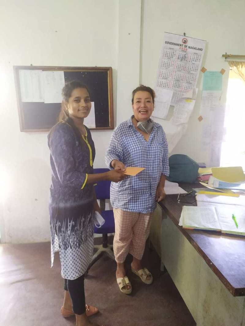 Avino Peseyie with one of her students who secured distinction marks at GHSS Chümoukedima on June 9. (DIPR Photo)