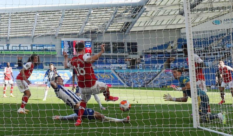 Soccer Football - Premier League - Brighton & Hove Albion v Arsenal - The American Express Community Stadium, Brighton, Britain - June 20, 2020 Brighton & Hove Albion's Lewis Dunk scores their first goal as play resumes behind closed doors following the outbreak of the coronavirus disease (COVID-19) Mike Hewitt/Pool via REUTERS