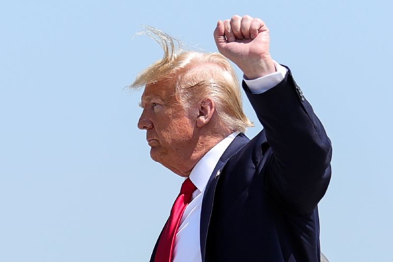 U.S. President Donald Trump gestures as he arrives at Bangor International Airport in Bangor, Maine, U.S., June 5, 2020. REUTERS/Tom Brenner