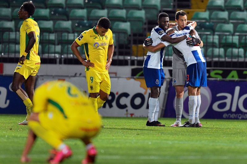 FC Porto's Agustin Marchesin and teammates celebrate after the match, as play resumes behind closed doors following the outbreak of the coronavirus disease (COVID-19) Octavio Passos/Pool via REUTERS