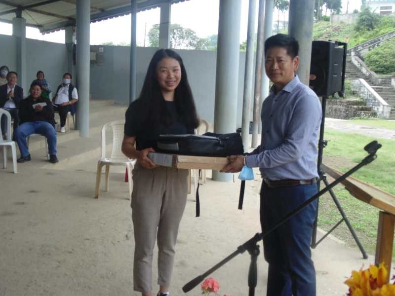 Beizo Suokhrie, Chairman of Baptist Mission School, Jotsoma felicitated Niepuzha-a Gwierie, the 18th rank holder in the HSLC examination 2020, and handed over a laptop and a cash award of Rs.30, 000.