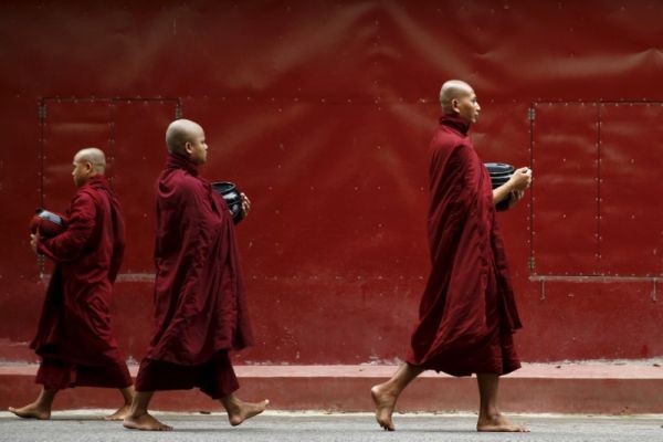 Buddhist monks walk inside the Masoyein monastery complex in Mandalay, Myanmar on October 7, 2015. (REUTERS File Photo)