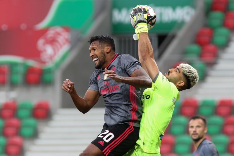 Maritimo's Abedzadeh in action with Benfica's Dyego Sousa, as play resumes behind closed doors following the outbreak of the coronavirus disease (COVID-19) Homem De Gouveia/Pool via REUTERS