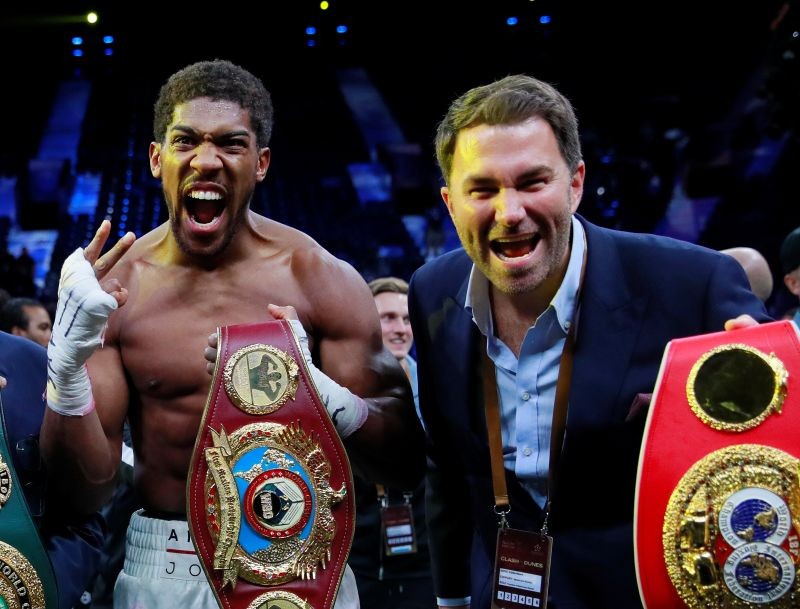 Anthony Joshua celebrates winning his match against Andy Ruiz Jr with promoter Eddie Hearn. (Reuters File Photo)