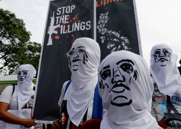 Activists wear hoods depicting families of victims killed in President Rodrigo Duterte's drug war as Duterte delivers his State of the Nation address in Quezon city, Metro Manila, in Philippines on July 23, 2018. (REUTERS File Photo)