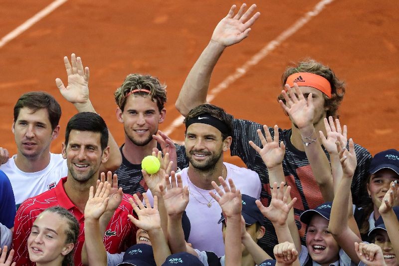 Bulgaria's Grigor Dimitrov, Serbia's Novak Djokovic, Dusan Lajovic, Austria's Dominic Thiem, Germany's Alexander Zverev pose for a photo with the ballkids during Adria Tour at Novak Tennis Centre in Belgrade, Serbia, June 12, 2020. Picture taken June 12, 2020. REUTERS/Marko Djurica