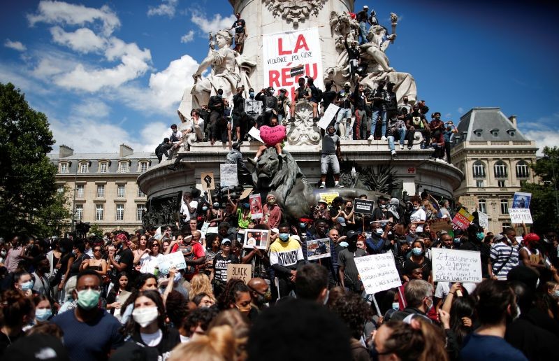 Demonstrators attend a protest against police brutality and the death in Minneapolis police custody of George Floyd, at the Place de la Republique square in Paris, France June 13, 2020. REUTERS/Benoit Tessier