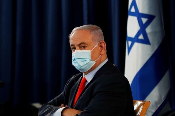 Israeli Prime Minister Benjamin Netanyahu wears a mask as he looks on during the weekly cabinet meeting in Jerusalem on May 31, 2020. (REUTERS File Photo)
