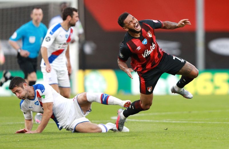 Bournemouth's Joshua King sustains an injury after a challenge by Crystal Palace's Gary Cahill as play resumes behind closed doors following the outbreak of the coronavirus disease (COVID-19) Ian Walton/Pool via REUTERS/File Photo