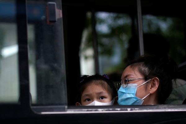 People wearing face masks are seen on a bus following an outbreak of the novel coronavirus disease (COVID-19), in Shanghai, China on May 31, 2020. (REUTERS Photo)