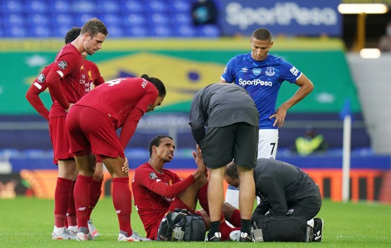 Liverpool's Joel Matip receives medical attention, as play resumes behind closed doors following the outbreak of the coronavirus disease (COVID-19) Jon Super/Pool via REUTERS/File Photo