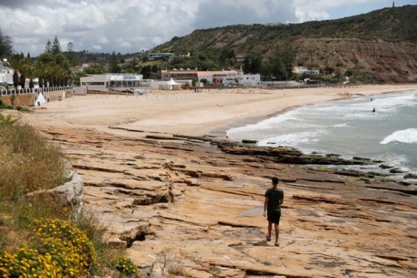 A man walks at the beach near the resort where three-year-old Madeleine McCann disappeared in 2007, in Praia da Luz, Portugal on June 4. (REUTERS Photo)