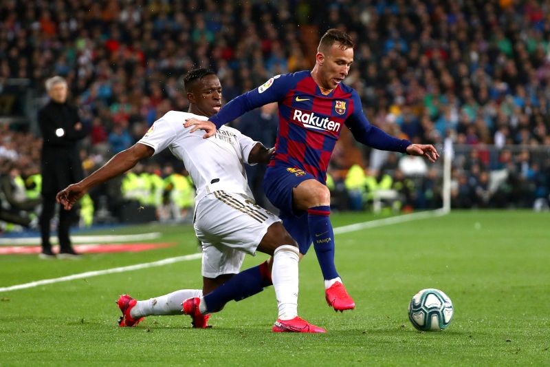 Barcelona's Arthur in action with Real Madrid's Vinicius Junior REUTERS/Sergio Perez/File Photo