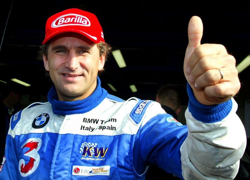FILE PHOTO: Italian BMW 320i racing car driver Alex Zanardi gives a thumbs up before the start of an LG Super Racing car event at the Monza race track October 19, 2003. REUTERS/Giampiero Sposito/File Photo