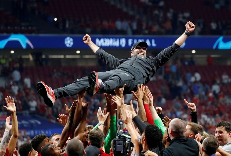 FILE PHOTO: Soccer Football - Champions League Final - Tottenham Hotspur v Liverpool - Wanda Metropolitano, Madrid, Spain - June 1, 2019 Liverpool manager Juergen Klopp is thrown in the air by the players as they celebrate after winning the Champions League REUTERS/Kai Pfaffenbach/File Photo