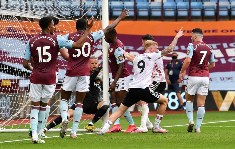 Aston Villa's Orjan Nyland appears to carry the ball over the goal line however a goal is not awarded as play resumes behind closed doors following the outbreak of the coronavirus disease (COVID-19) Paul Ellis/Pool via REUTERS