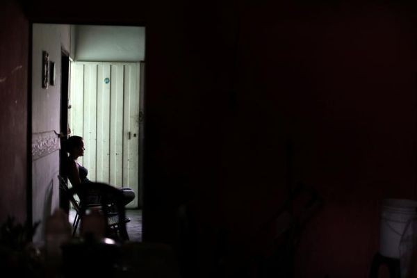 Yuleixis Hernandez, widow of Euvis Peroza, who died after members of the Special Action Force of the Venezuelan National Police (FAES) shot him, sits at her in-laws' home, in Barquisimeto, Venezuela on September 19, 2019. (REUTERS File Photo)