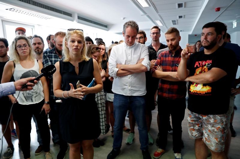 Deputy editor in chief Veronika Munk speaks next to employees of Hungary's main independent news website "Index" as they gather in the newsroom after they quit over the recent ousting of editor in chief Szabolcs Dull, in Budapest, Hungary on July 24. (REUTERS Photo)