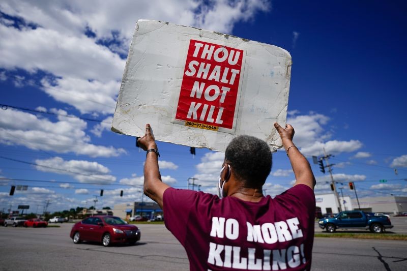 Reverend Sylvester Edwards, President of the Terre Haute NAACP, stands near the Federal Correctional Institution, Terre Haute, to express his opposition to the death penalty and execution of Daniel Lewis Lee, who is convicted in the killing of three members of an Arkansas family in 1996, and would be the first federal execution in 17 years, in Terre Haute, Indiana, US ON July 13, 2020.  (REUTERS Photo)