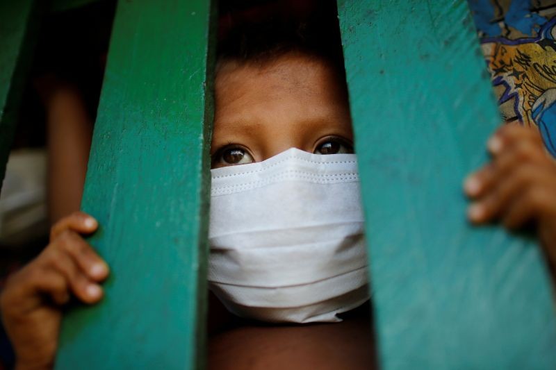 A child from the indigenous Yanomami ethnic group wearing protective face mask looks on, amid the spread of the coronavirus disease (COVID-19), at the 5th Special Frontier Platoon in the municipality of Auaris, state of Roraima, Brazil on June 30, 2020. (REUTERS File Photo)