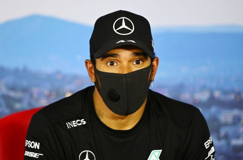 Mercedes' Lewis Hamilton wears a face mask during the post qualifying press conference FIA/Handout via REUTERS