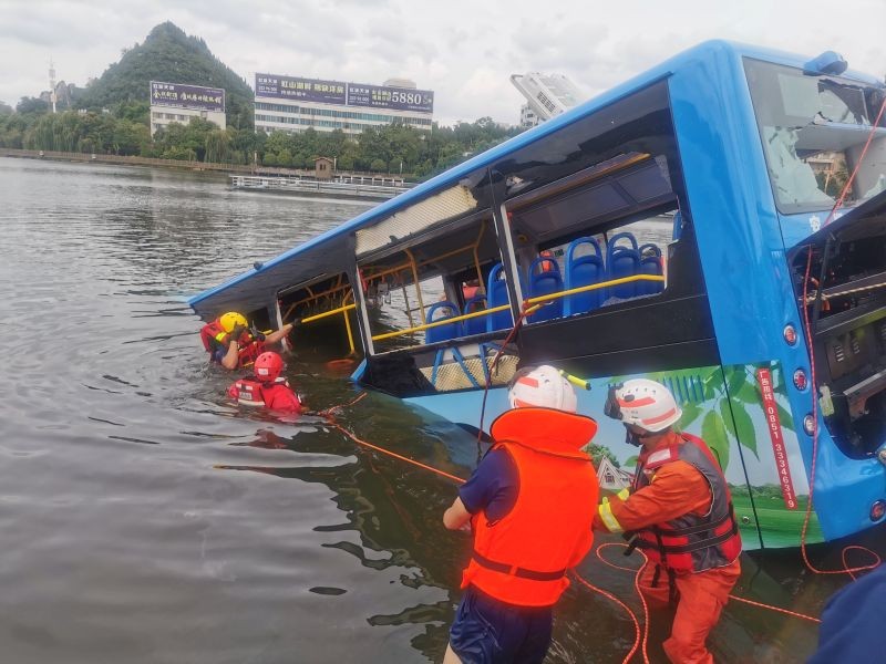 Rescue workers are seen at the site where a bus carrying students plunged into a reservoir, in Anshun, Guizhou province, China on July 7. (REUTERS Photo)