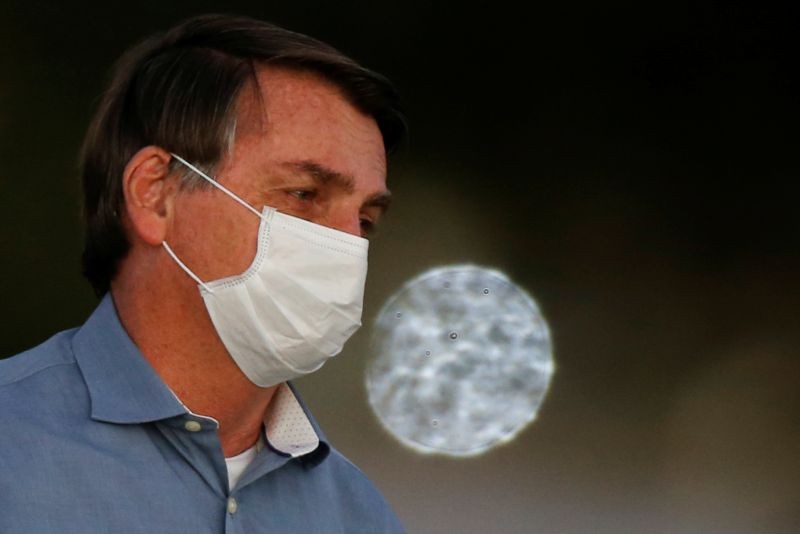 Brazil's President Jair Bolsonaro looks on during a ceremony of lowering the national flag for the night, amid the coronavirus disease (COVID-19) outbreak, at the Alvorada Palace in Brasilia, Brazil on July 24, 2020. (REUTERS File Photo)