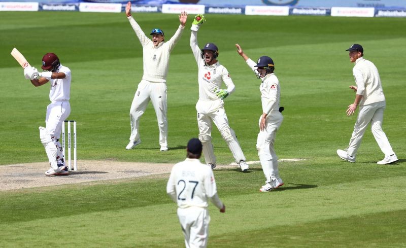 Cricket - Second Test - England v West Indies - Emirates Old Trafford, Manchester, Britain - July 19, 2020 England's Jos Buttler and Joe Root appeal unsuccessfully for the wicket of West Indies' Shai Hope, as play resumes behind closed doors following the outbreak of the coronavirus disease (COVID-19) Michael Steele/Pool via REUTERS