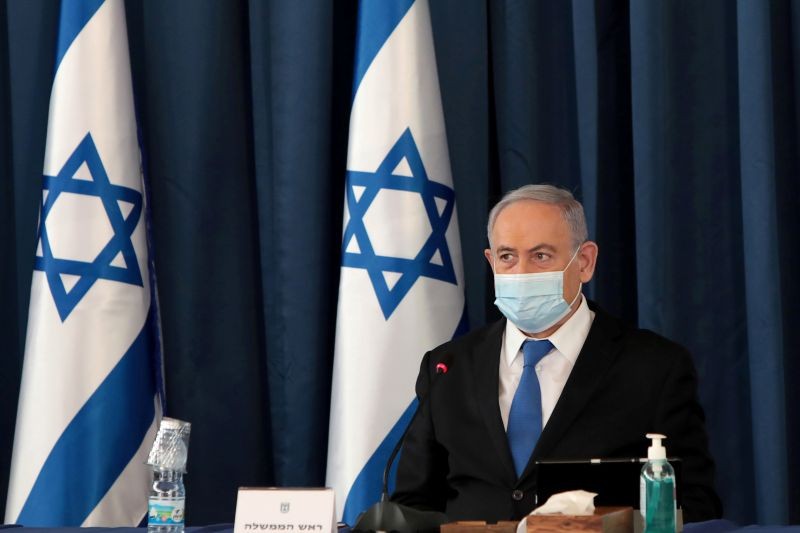 Israeli Prime Minister Netanyahu wears a protective mask, amid the spread of the coronavirus disease (COVID-19), as he holds a weekly cabinet meeting at the Foreign Ministry in Jerusalem on July 5, 2020. (REUTERS File Photo)
