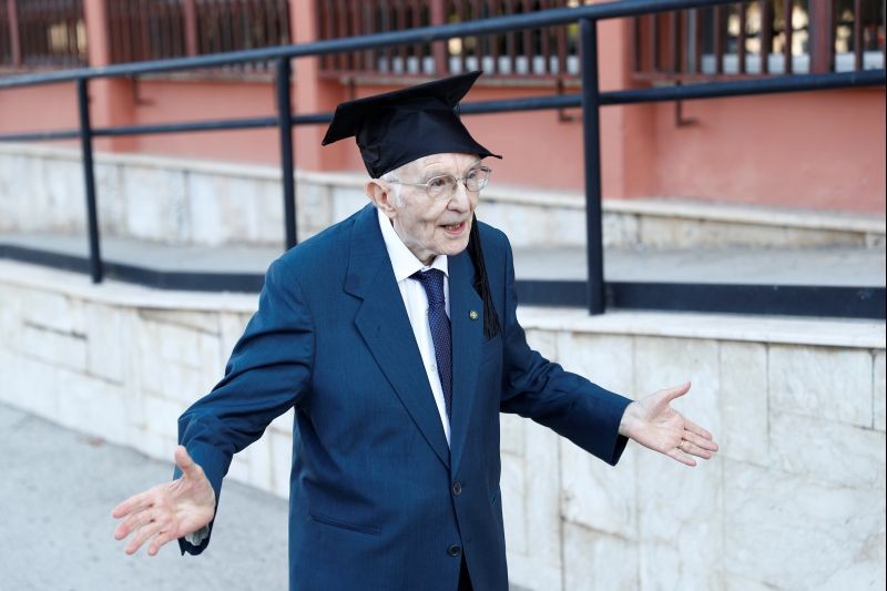 Giuseppe Paterno, 96, Italy's oldest student, celebrates after graduating from his undergraduate degree in history and philosophy during his graduation at the University of Palermo, in Palermo, Italy on July 29, 2020. "I am a normal person, like many others," Paterno said, when asked what it felt like to be graduating so late. "In terms of age I have surpassed all the others but I didn't do it for this." (REUTERS Photo)
