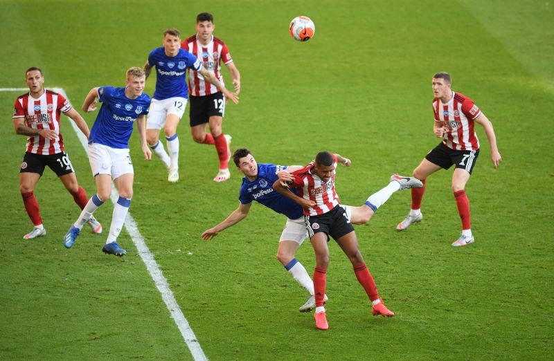 Everton's Michael Keane in action with Sheffield United's Richairo Zivkovic, as play resumes behind closed doors following the outbreak of the coronavirus disease (COVID-19) Pool via REUTERS/Michael Regan